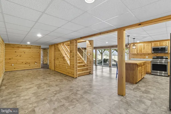 a view of a bathroom with a shower and a sink