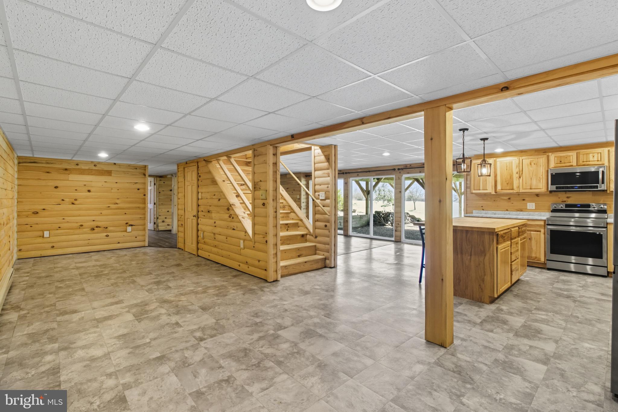 107 Linkin Park Drive Spring Mills, PA 16875 - Photo 45 of 66 a view of an empty room with window and an kitchen view