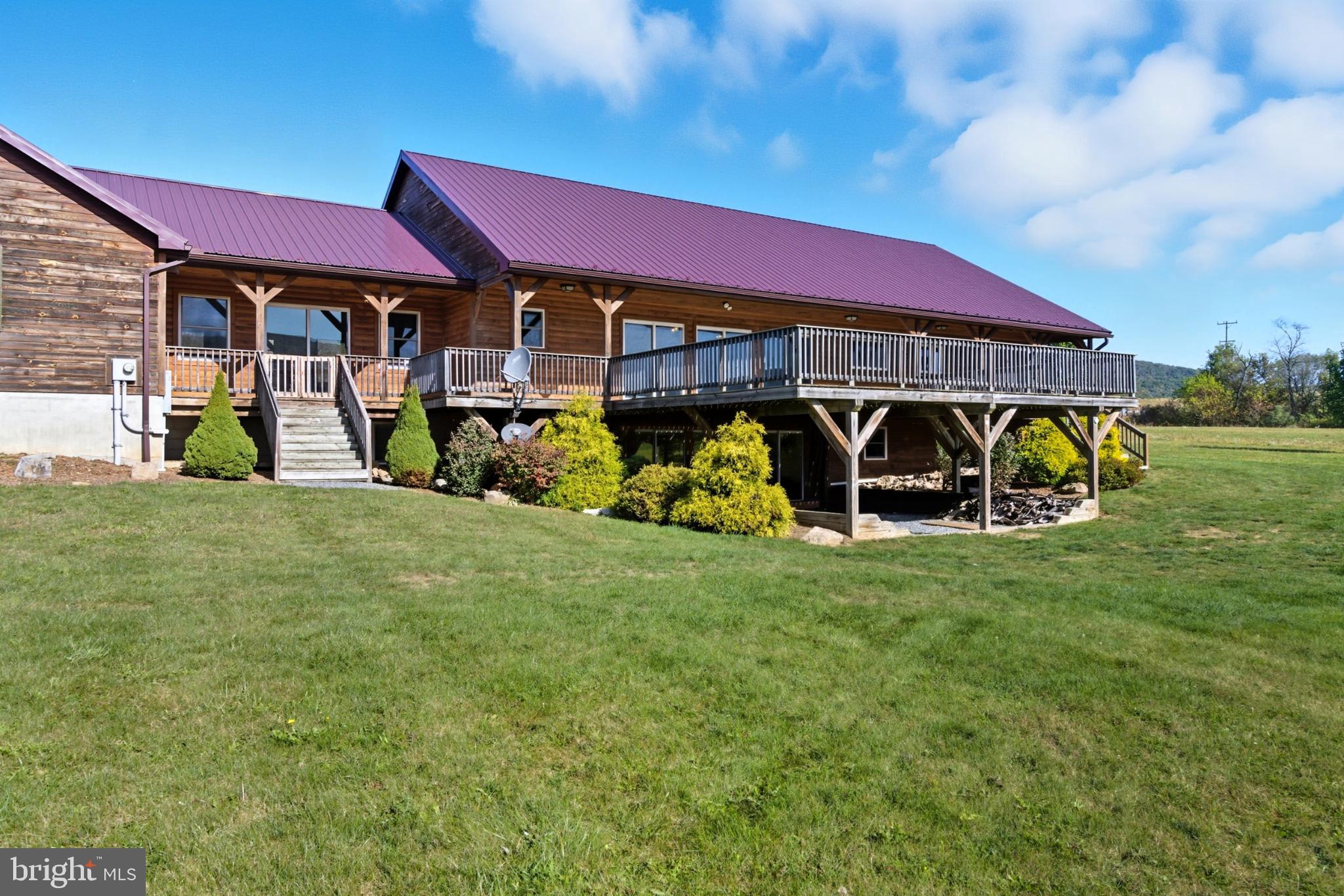 107 Linkin Park Drive Spring Mills, PA 16875 - Photo 64 of 66 a front view of a house with garden
