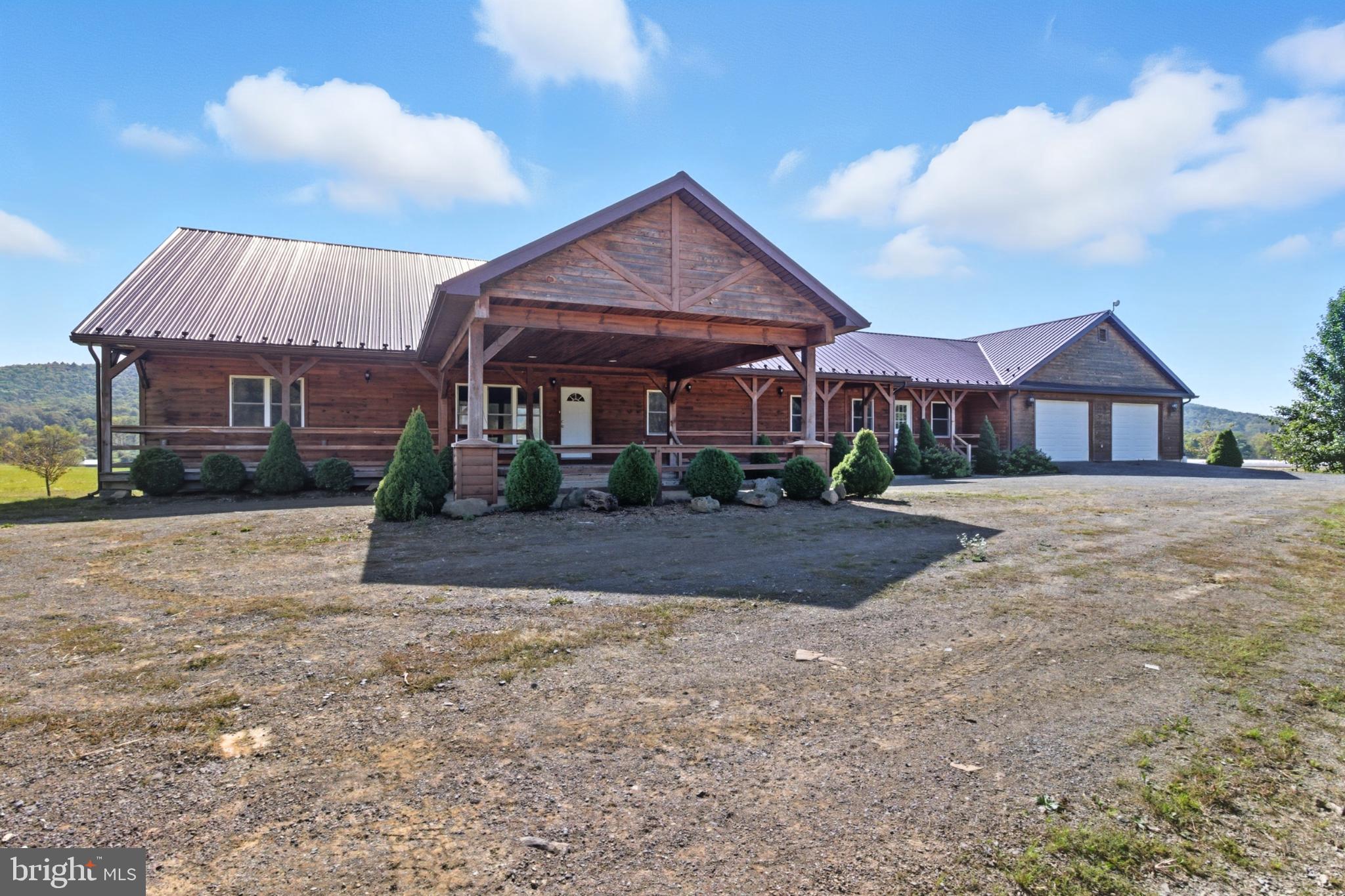 107 Linkin Park Drive Spring Mills, PA 16875 - Photo 8 of 66 a view of house with a yard and potted plants