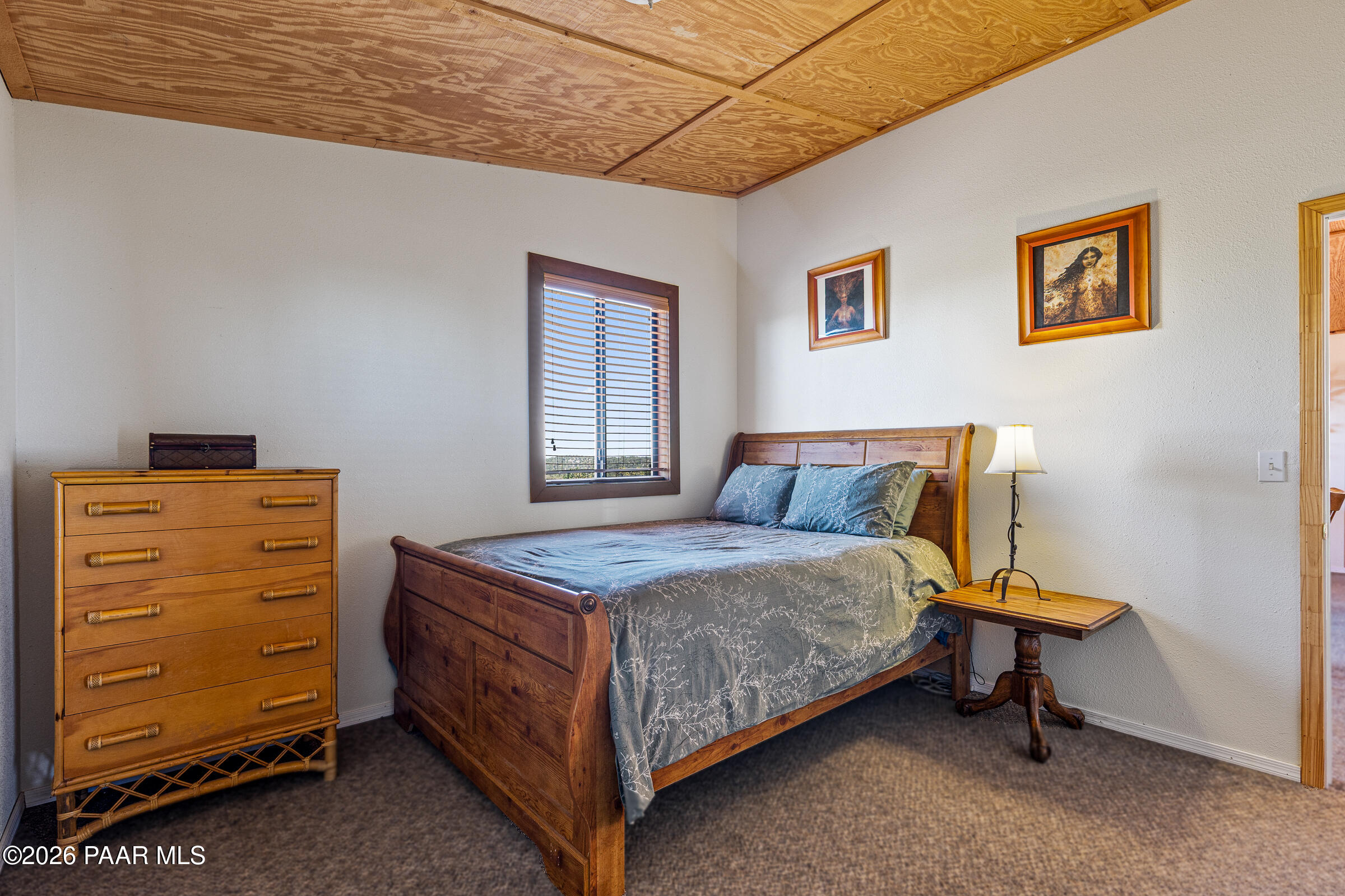 33749 West Whiskey River Road, Unit 21 Seligman, AZ 86337 - Photo 17 of 41 a bedroom with a bed and a dresser