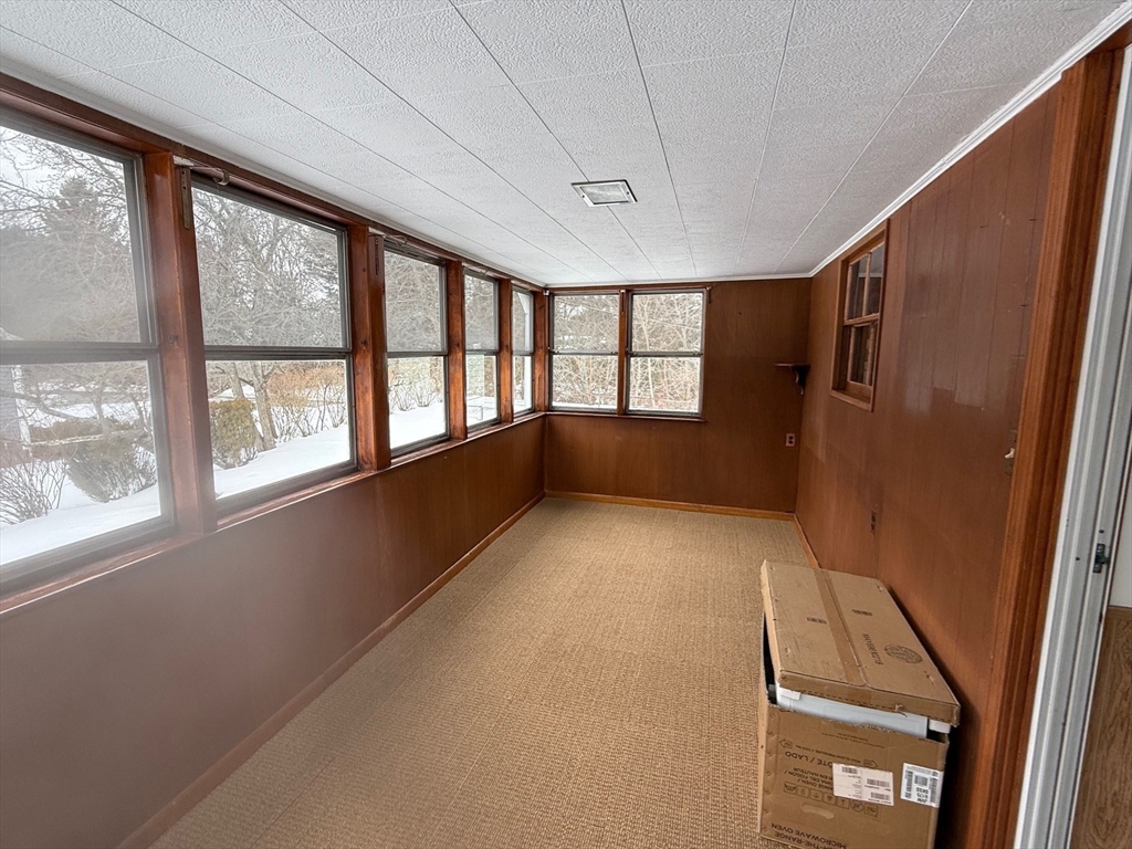 970 Trapelo Road Waltham, MA 02452 - Photo 17 of 25 a view of an empty room with a window