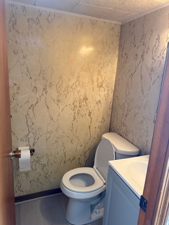 970 Trapelo Road Waltham, MA 02452 - Photo 20 of 25 a bathroom with a toilet and a shower curtain