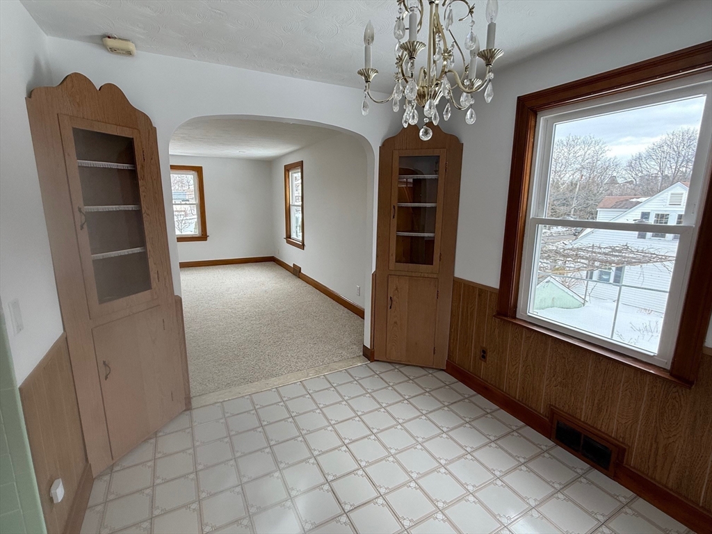970 Trapelo Road Waltham, MA 02452 - Photo 3 of 25 wooden floor in an empty room with a window