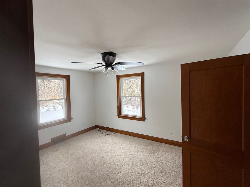 970 Trapelo Road Waltham, MA 02452 - Photo 5 of 25 an empty room with windows and closet