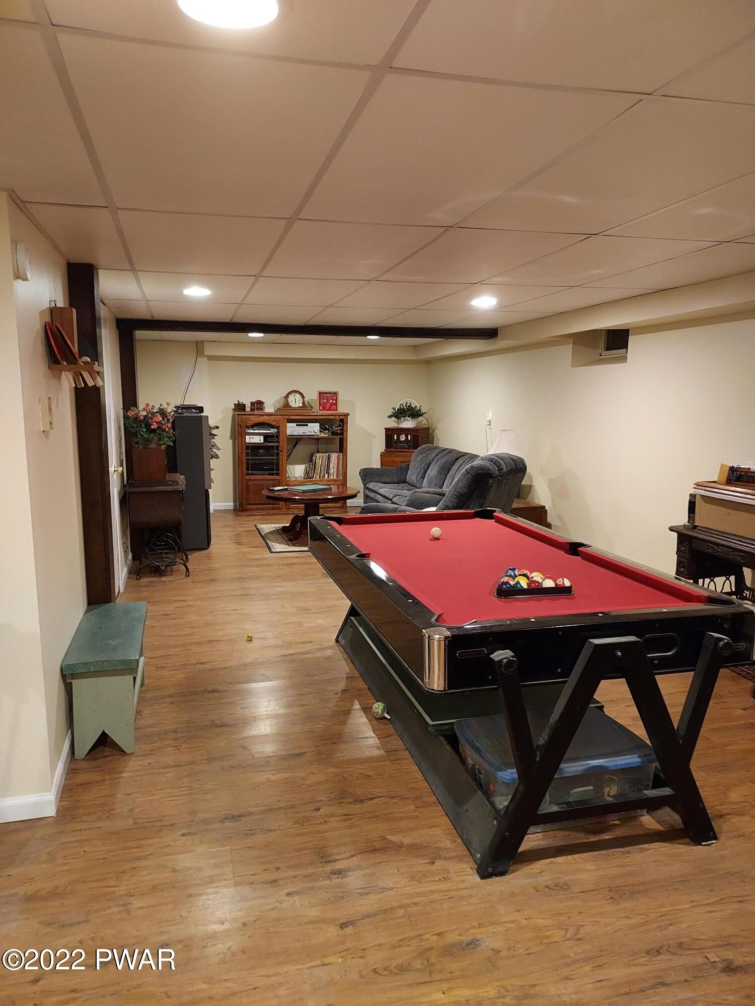 111 Rodeo Lane Hawley, PA 18428 - Photo 7 of 23 a room with gym equipment and a table