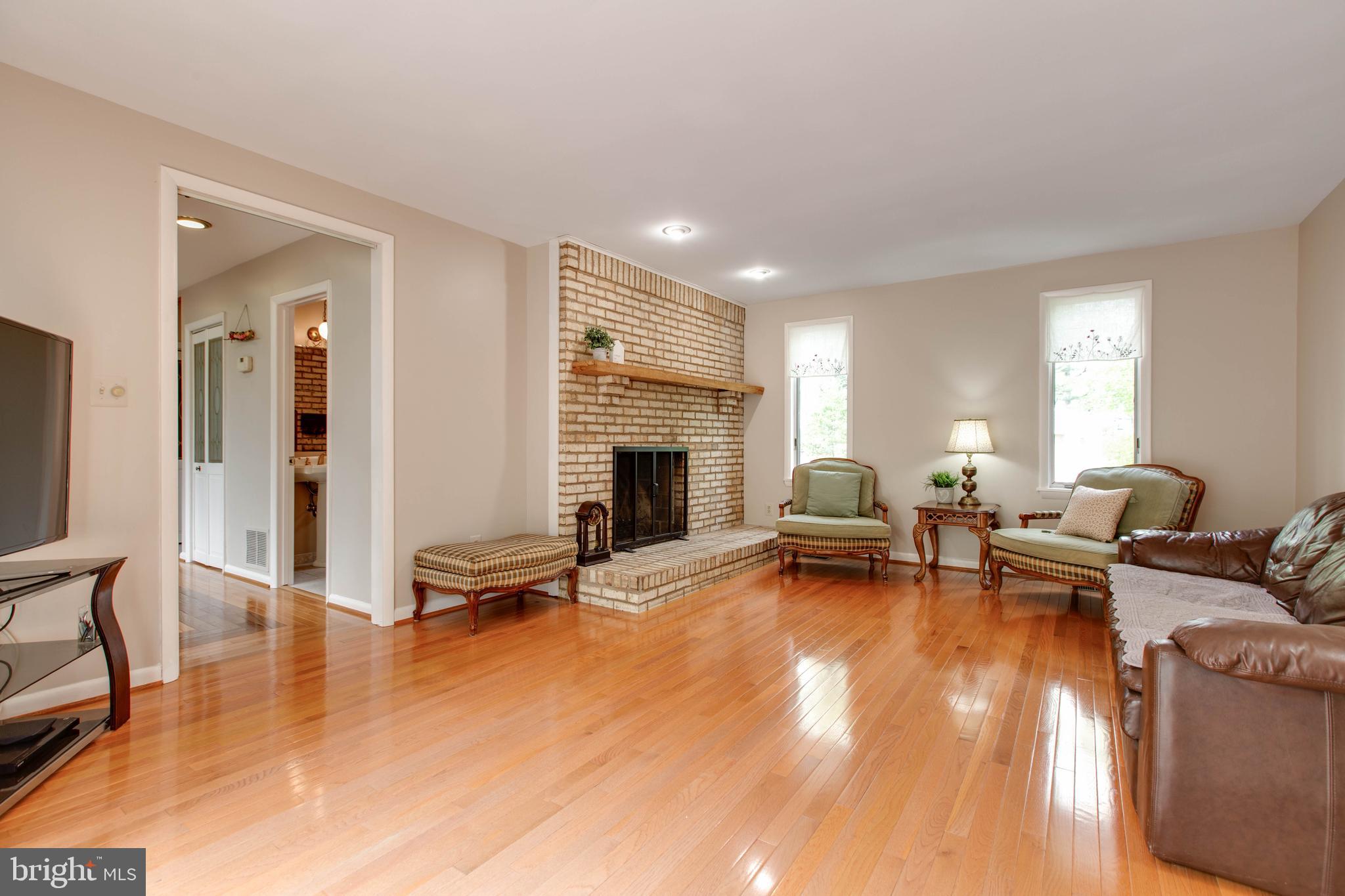 5519 Woodbine Road Sykesville, MD 21784 - Photo 14 of 69 a living room with furniture and a fireplace