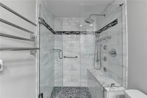 a bathroom with a shower and a sink