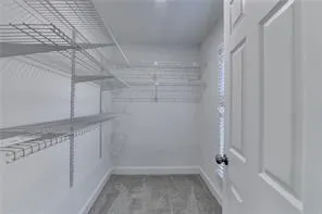 a view of a room with racks on the wall