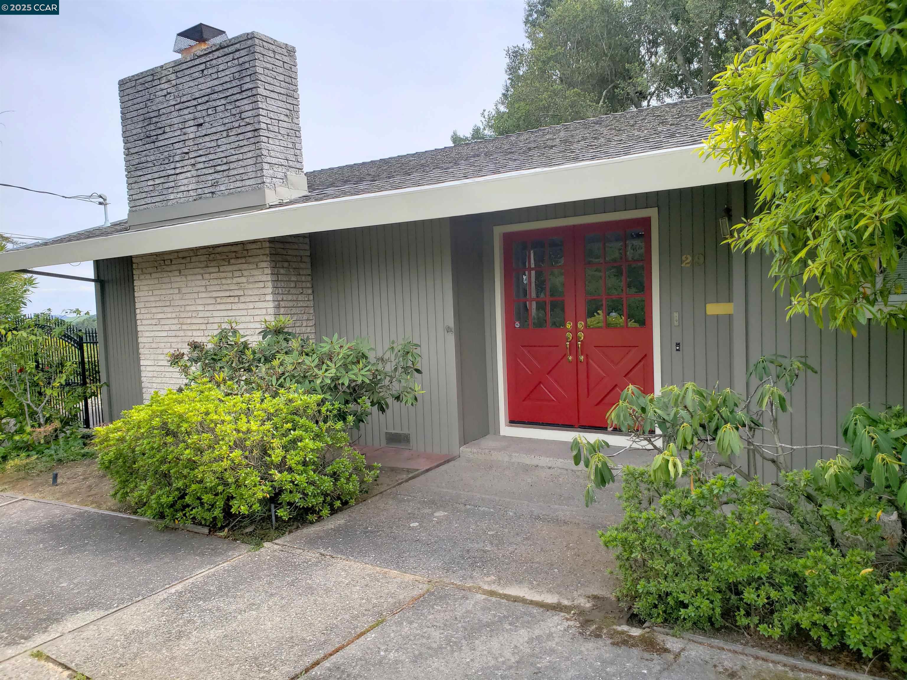 front view of a house with a yard