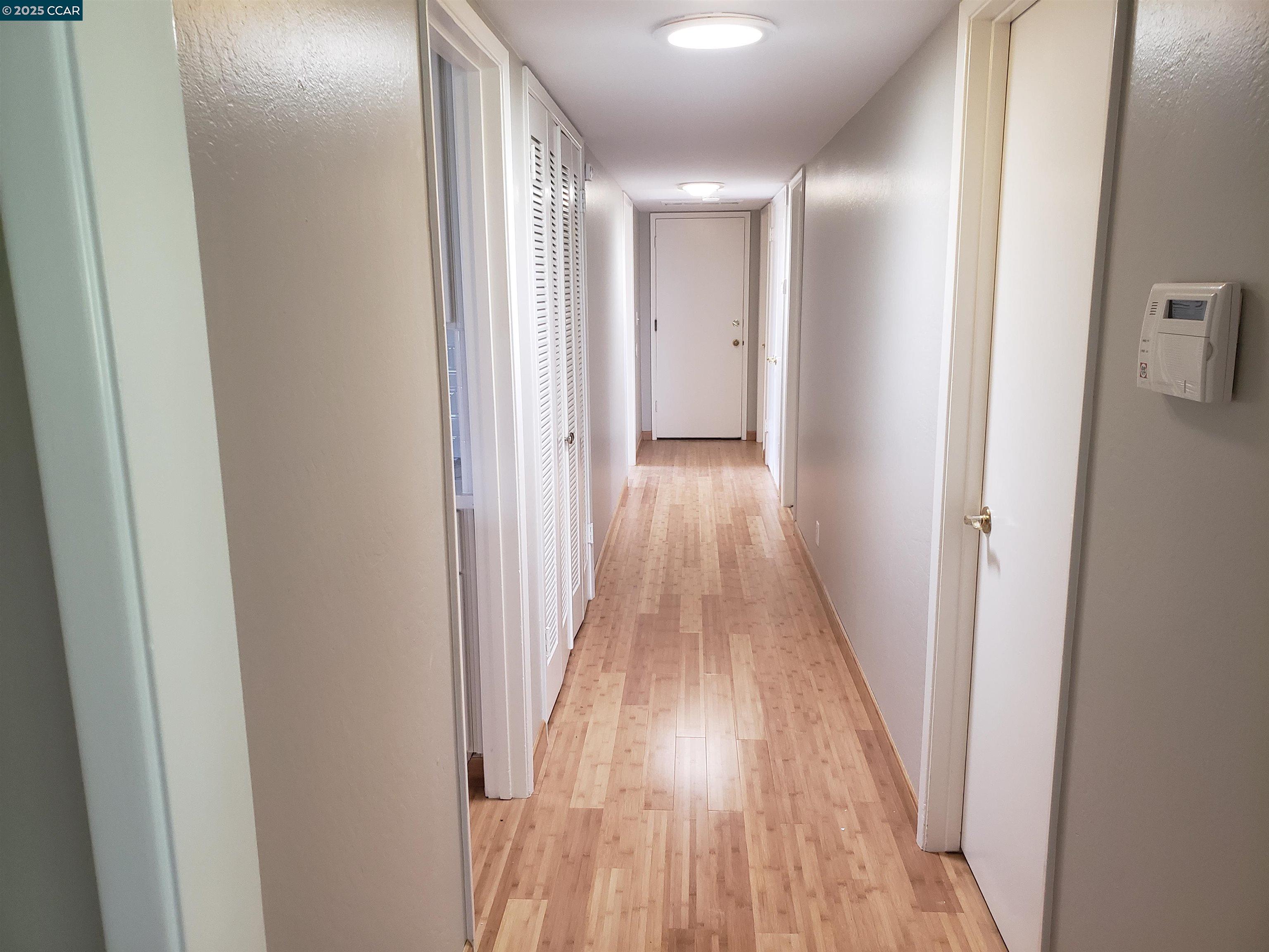 29 Chapel Drive Lafayette, CA 94549 - Photo 16 of 22 a view of a hallway with wooden floor