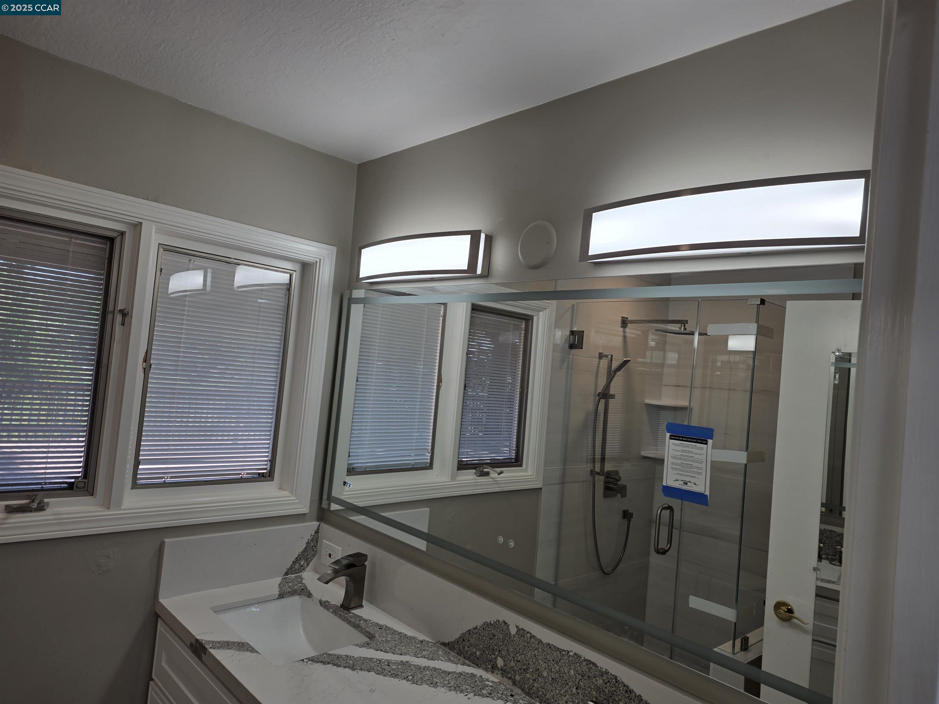 29 Chapel Drive Lafayette, CA 94549 - Photo 6 of 22 a bathroom with double vanity and a shower