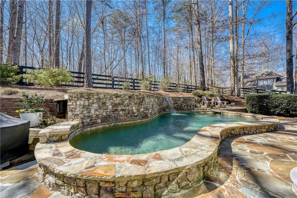 14124 Hopewell Road Alpharetta, GA 30004 - Photo 12 of 31 a view of swimming pool with a patio