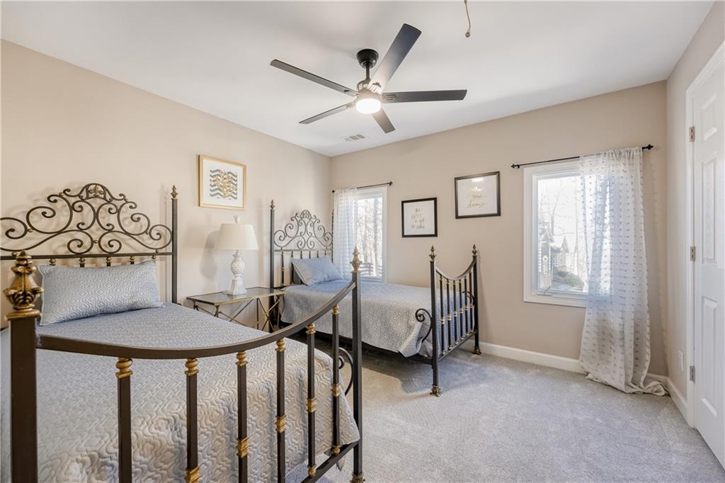 14124 Hopewell Road Alpharetta, GA 30004 - Photo 14 of 31 a view of a livingroom with furniture and a ceiling fan