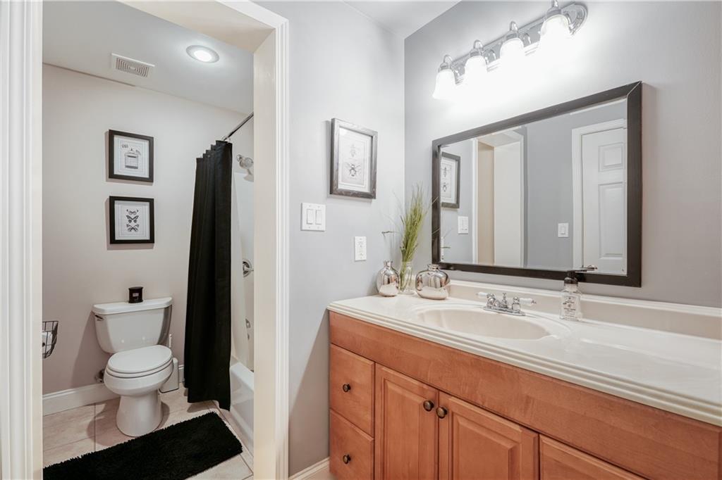 14124 Hopewell Road Alpharetta, GA 30004 - Photo 15 of 31 a bathroom with a sink toilet and shower