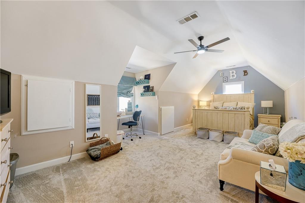 14124 Hopewell Road Alpharetta, GA 30004 - Photo 16 of 31 a view of a livingroom with furniture and a ceiling fan