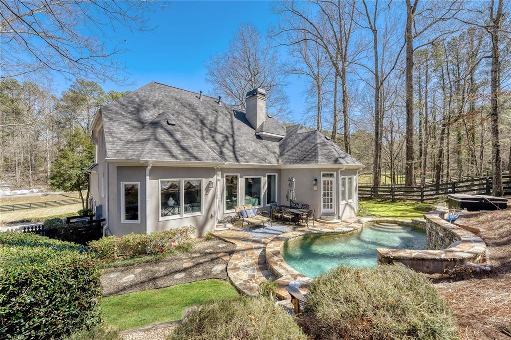 14124 Hopewell Road Alpharetta, GA 30004 - Photo 20 of 31 a front view of a house with garden