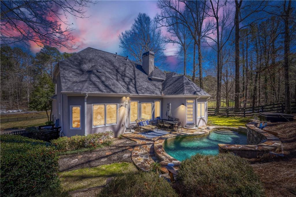 14124 Hopewell Road Alpharetta, GA 30004 - Photo 23 of 31 a front view of a house with garden