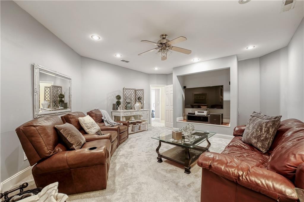 14124 Hopewell Road Alpharetta, GA 30004 - Photo 7 of 31 a living room with furniture and a flat screen tv