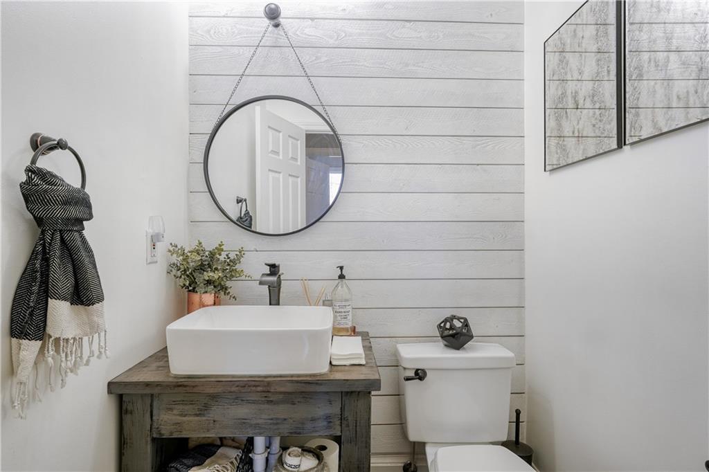 14124 Hopewell Road Alpharetta, GA 30004 - Photo 8 of 31 a bathroom with a sink and a mirror