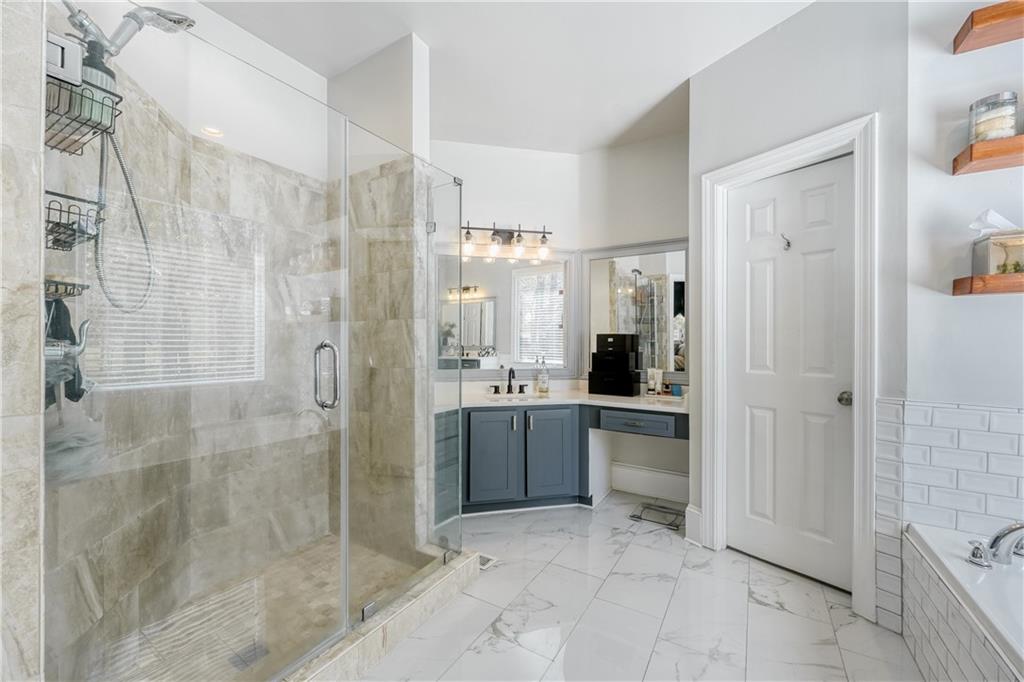 14124 Hopewell Road Alpharetta, GA 30004 - Photo 10 of 31 a large bathroom with a shower and a sink