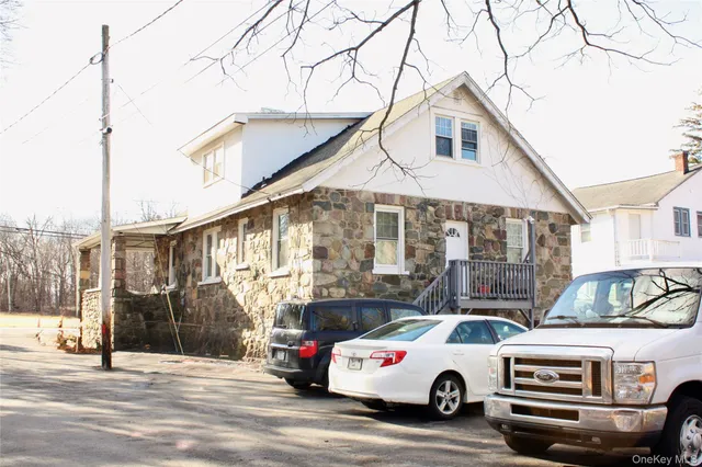 a car parked in front of a house