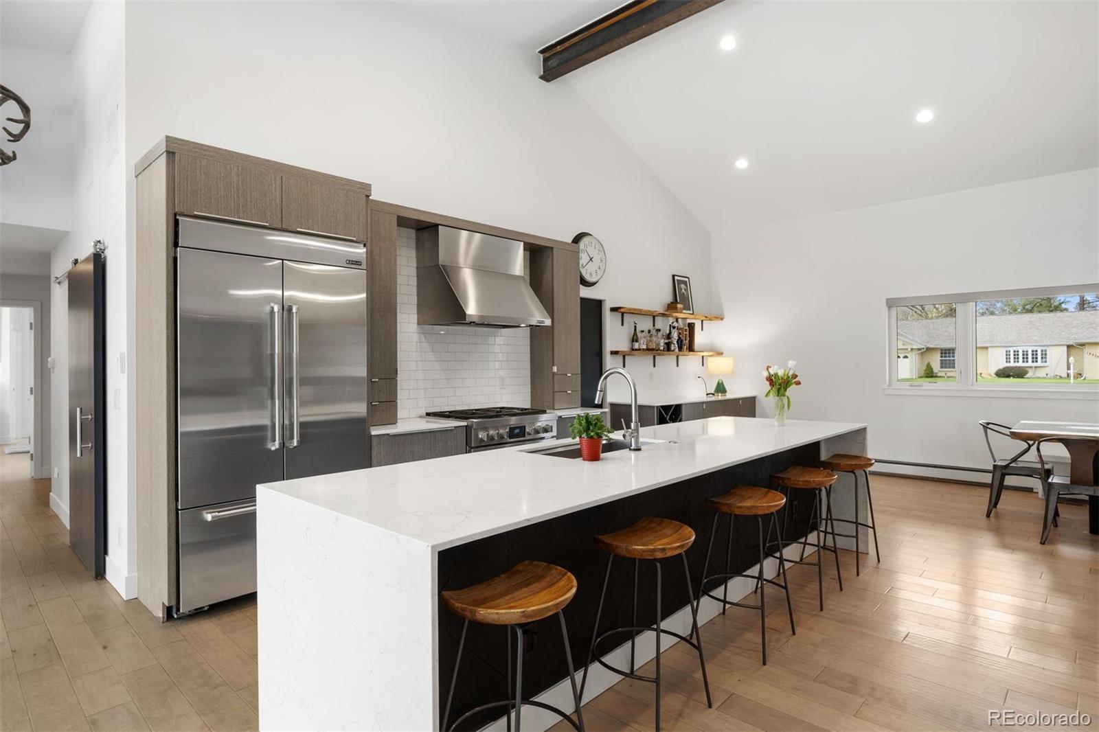 13380 Braun Road Golden, CO 80401 - Photo 14 of 49 a kitchen with granite countertop a sink and chairs