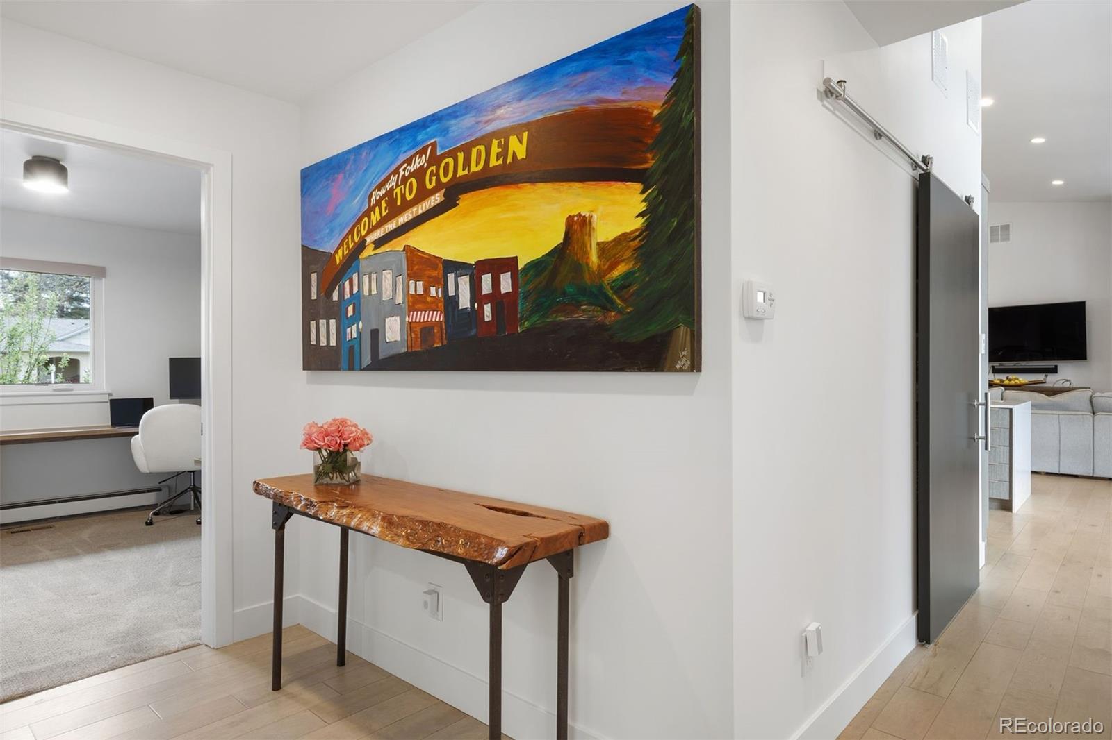 13380 Braun Road Golden, CO 80401 - Photo 18 of 49 a living room with furniture and a painting on the wall