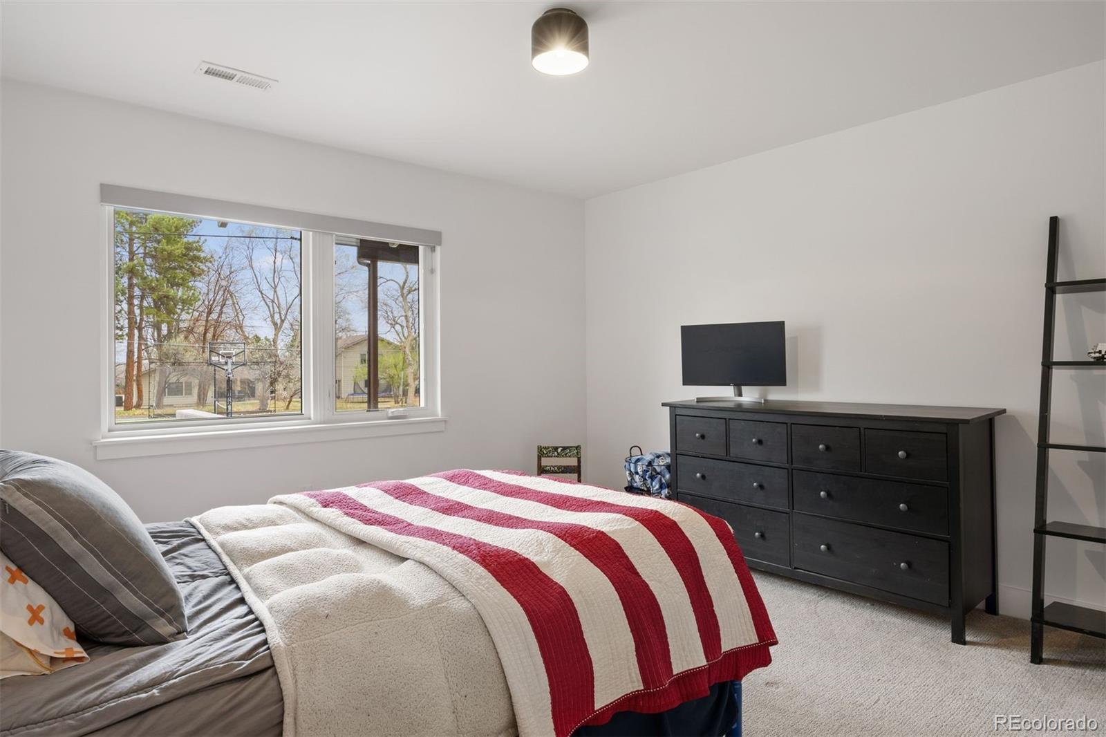 13380 Braun Road Golden, CO 80401 - Photo 30 of 49 a bedroom with a bed and a window