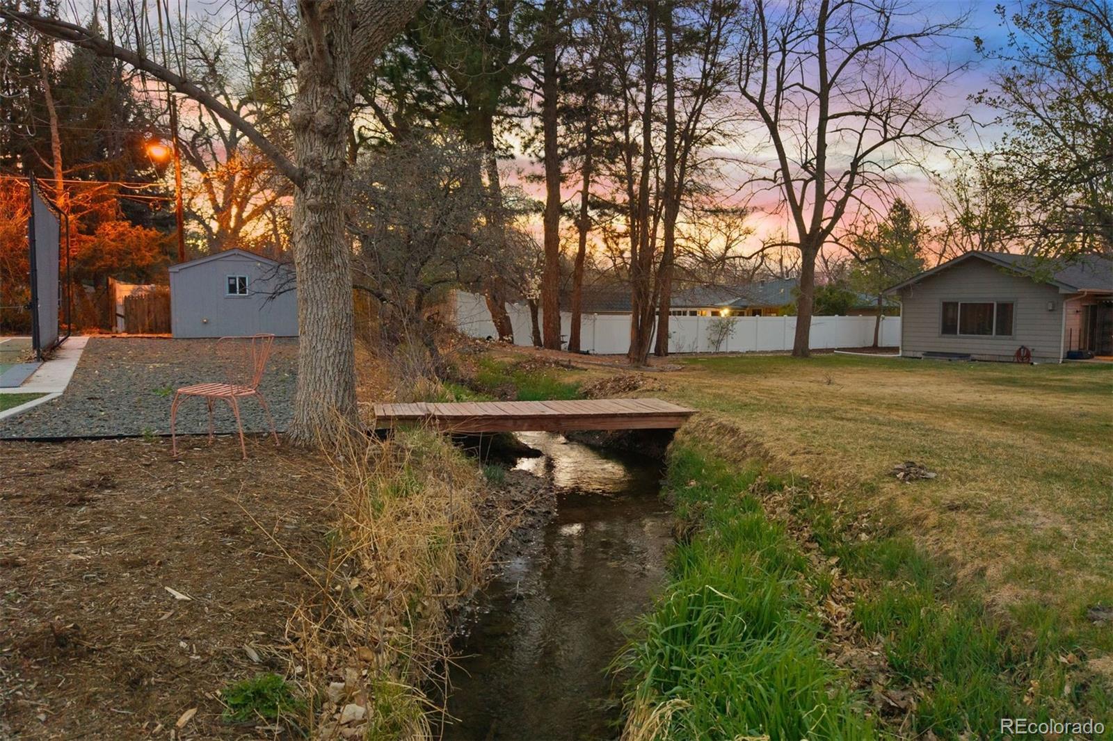 13380 Braun Road Golden, CO 80401 - Photo 44 of 49 a view of a house with a yard