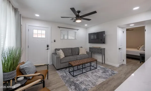 a living room with furniture and a flat screen tv