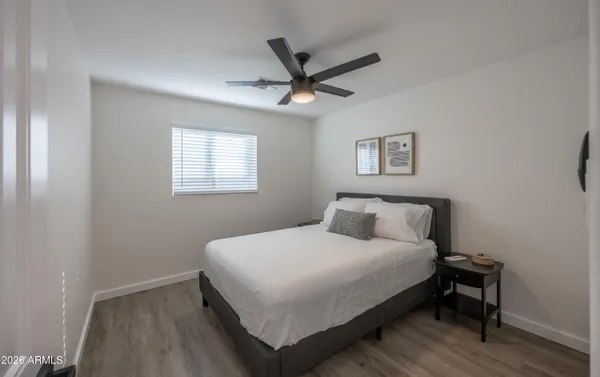 a bedroom with a bed and a window