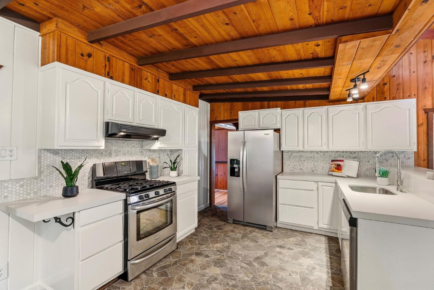 194 Lazy Woods Road Felton, CA 95018 - Photo 25 of 58 a kitchen with stainless steel appliances a refrigerator a sink and white cabinets