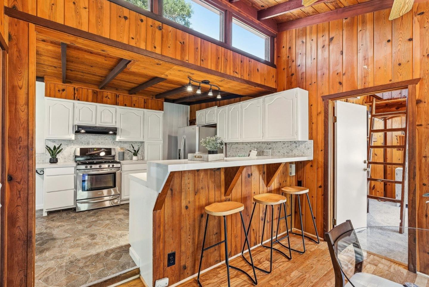 194 Lazy Woods Road Felton, CA 95018 - Photo 30 of 58 a kitchen with stainless steel appliances granite countertop a stove and more cabinets