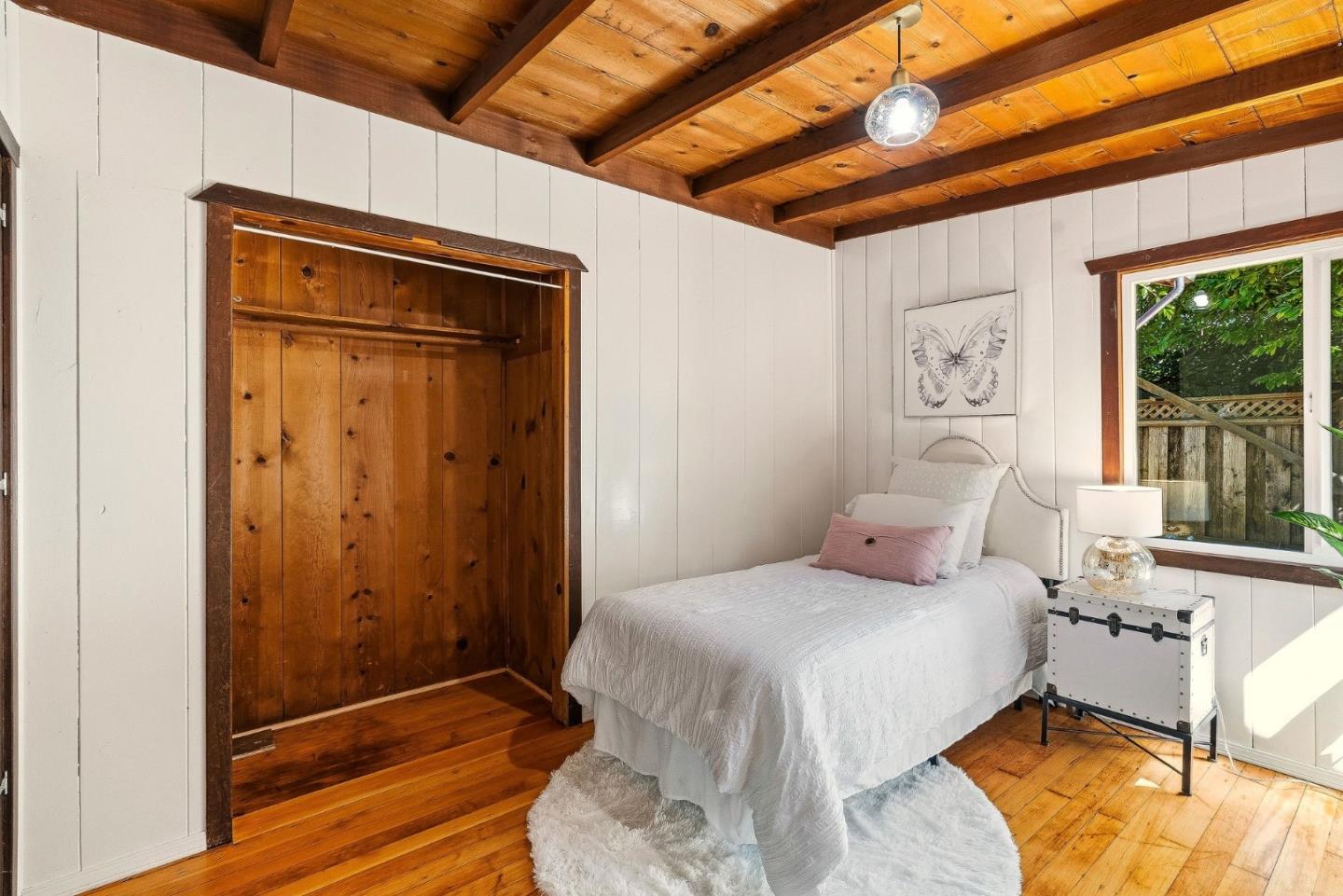 194 Lazy Woods Road Felton, CA 95018 - Photo 36 of 58 a bedroom with a bed and a window