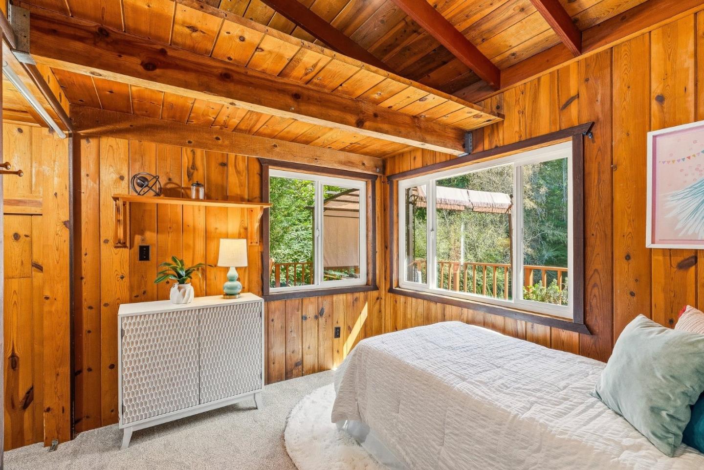 194 Lazy Woods Road Felton, CA 95018 - Photo 40 of 58 a bedroom with a bed and large windows