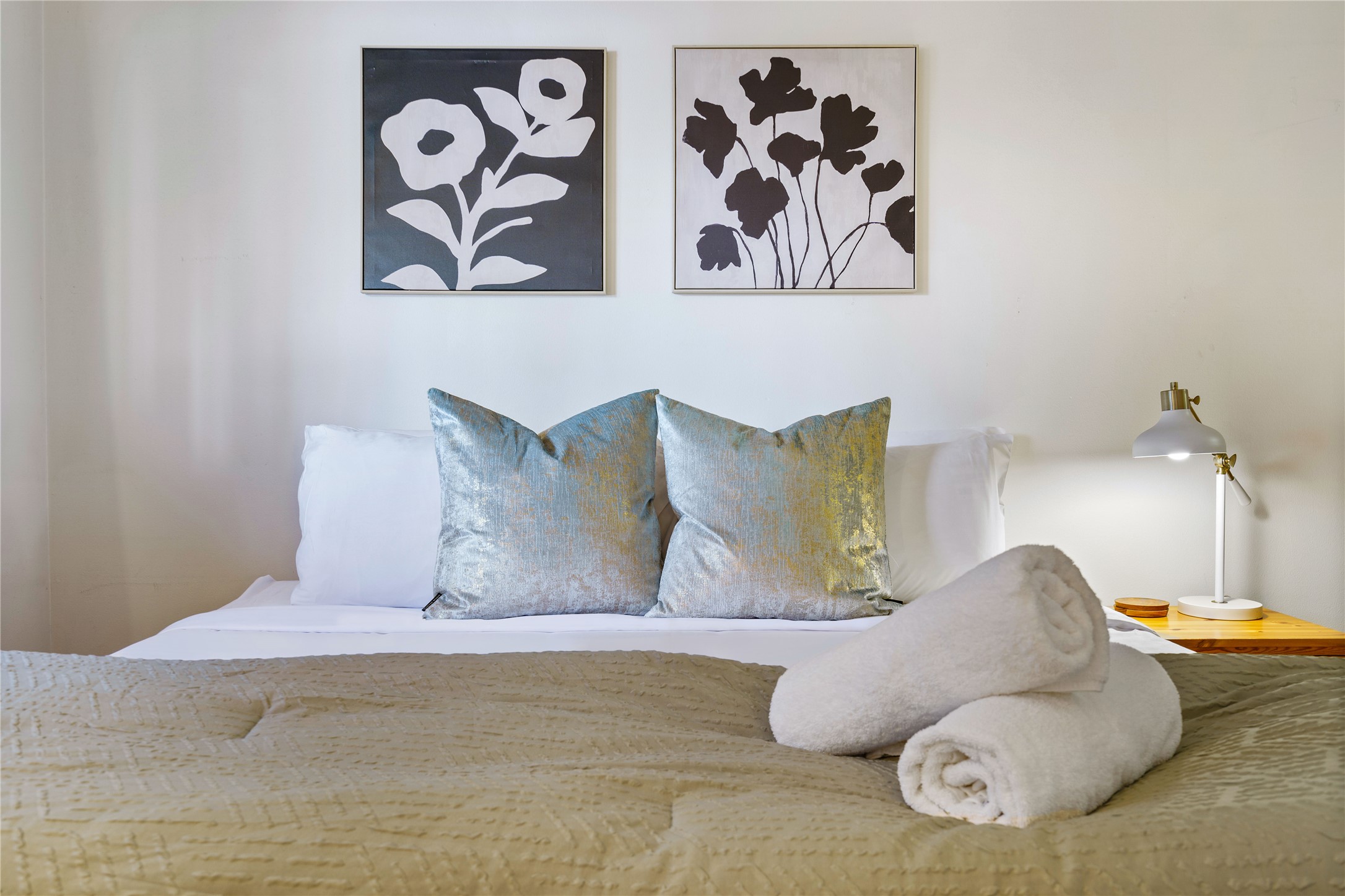 1422 Collier Street, Unit 214 Austin, TX 78704 - Photo 16 of 25 a large bed sitting next to a white wall