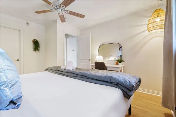 a bedroom with a bed and a dresser