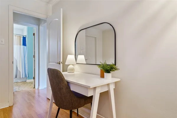 a dining room with furniture and wooden floor
