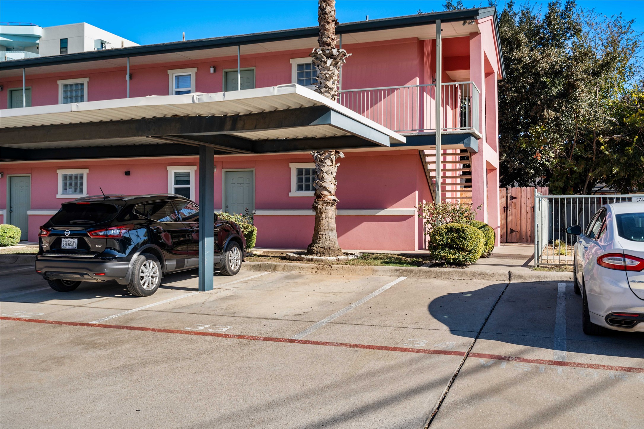 1422 Collier Street, Unit 214 Austin, TX 78704 - Photo 22 of 25 a view of a car park in front of a building