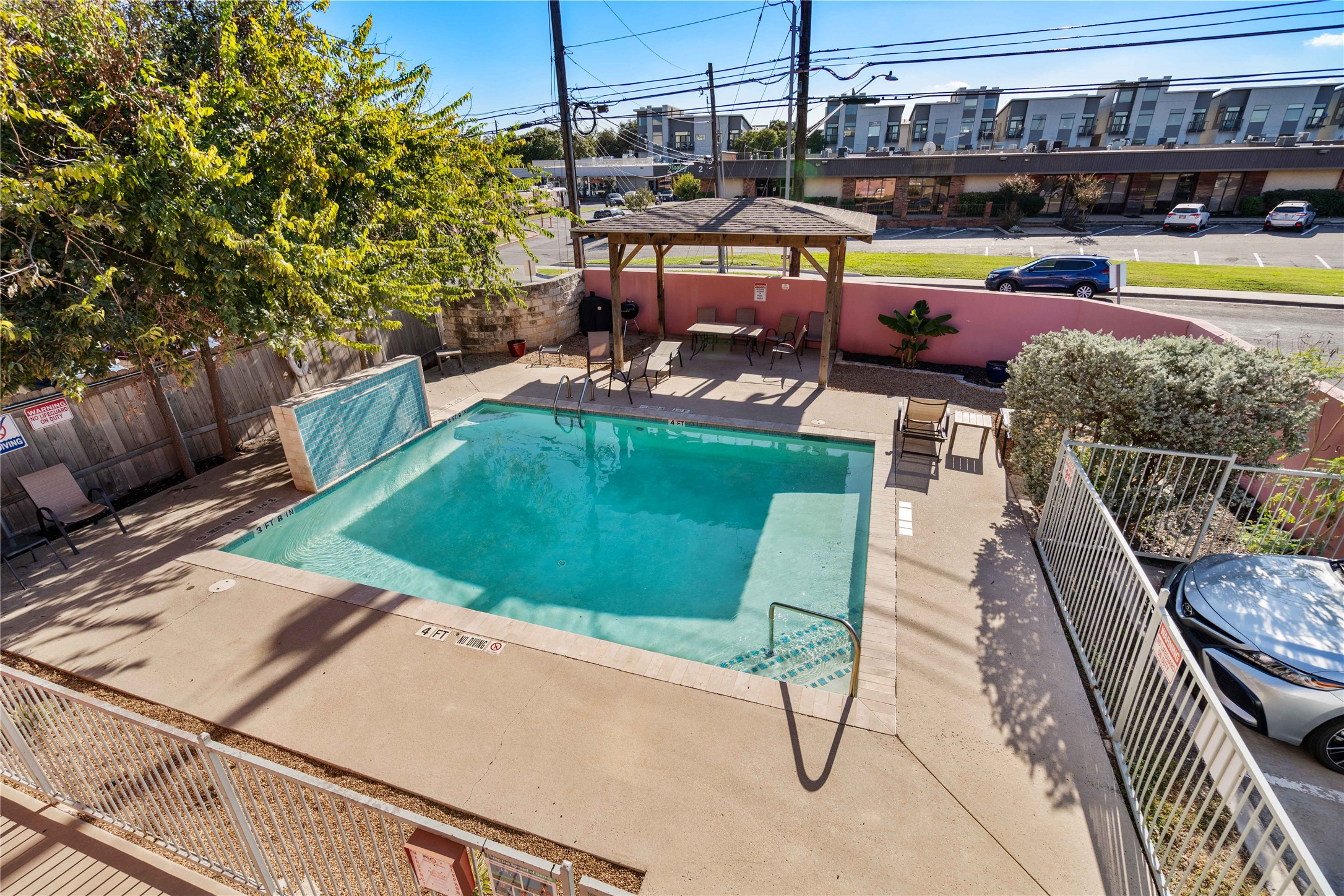 1422 Collier Street, Unit 214 Austin, TX 78704 - Photo 23 of 25 a view of a swimming pool with sitting area
