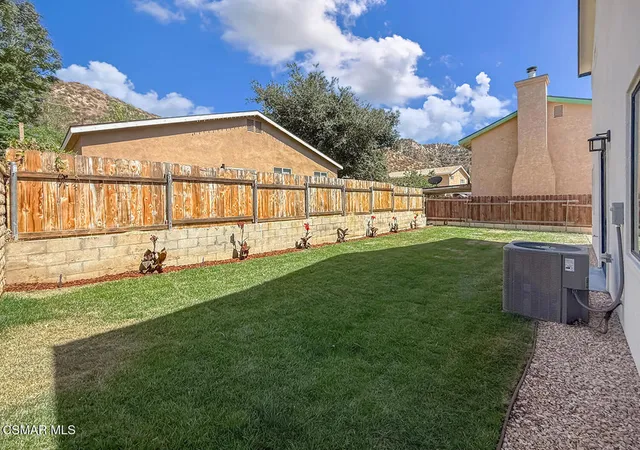 a view of a backyard with a garden and plants