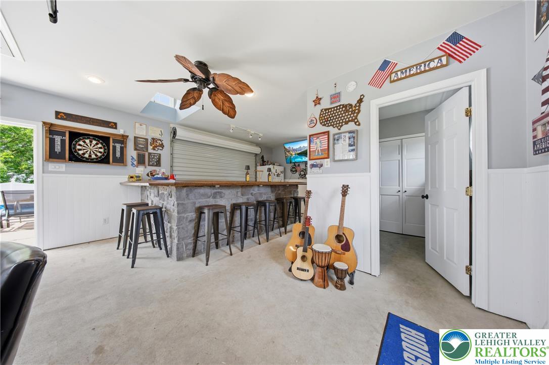 890 Lahr Road Nazareth, PA 18064 - Photo 38 of 71 A casual entertainment space boasts a stone-clad bar, perfect for gatherings.