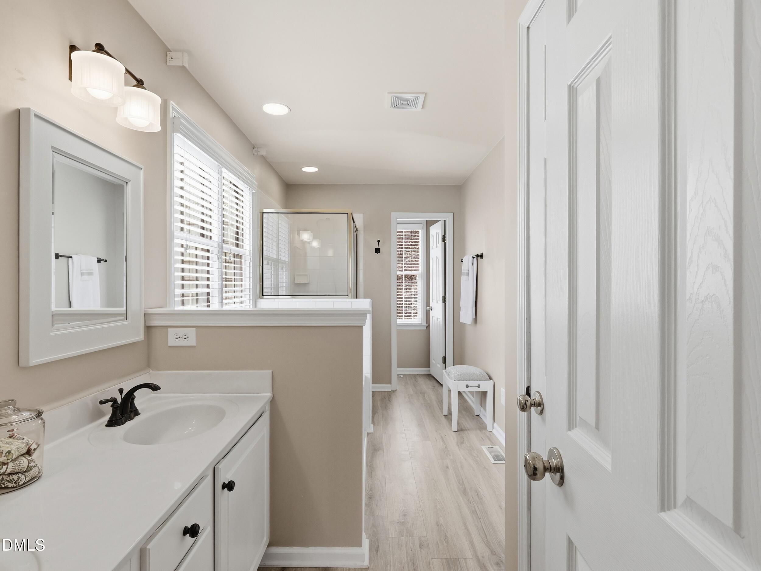 300 Nottinghill Walk Apex, NC 27502 - Photo 18 of 29 a bathroom with a sink vanity granite tub and shower