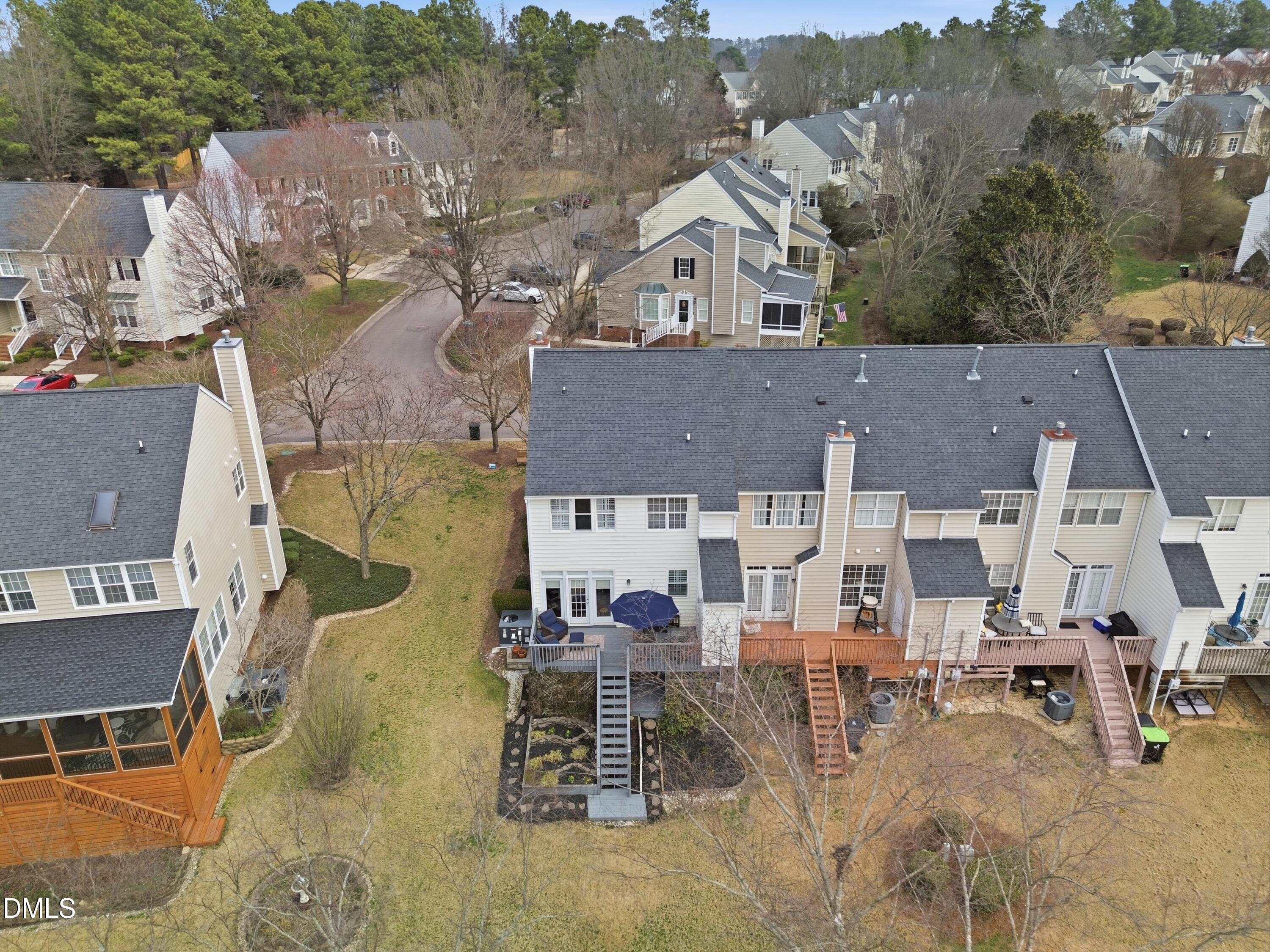 300 Nottinghill Walk Apex, NC 27502 - Photo 26 of 29 an aerial view of multiple houses with a yard