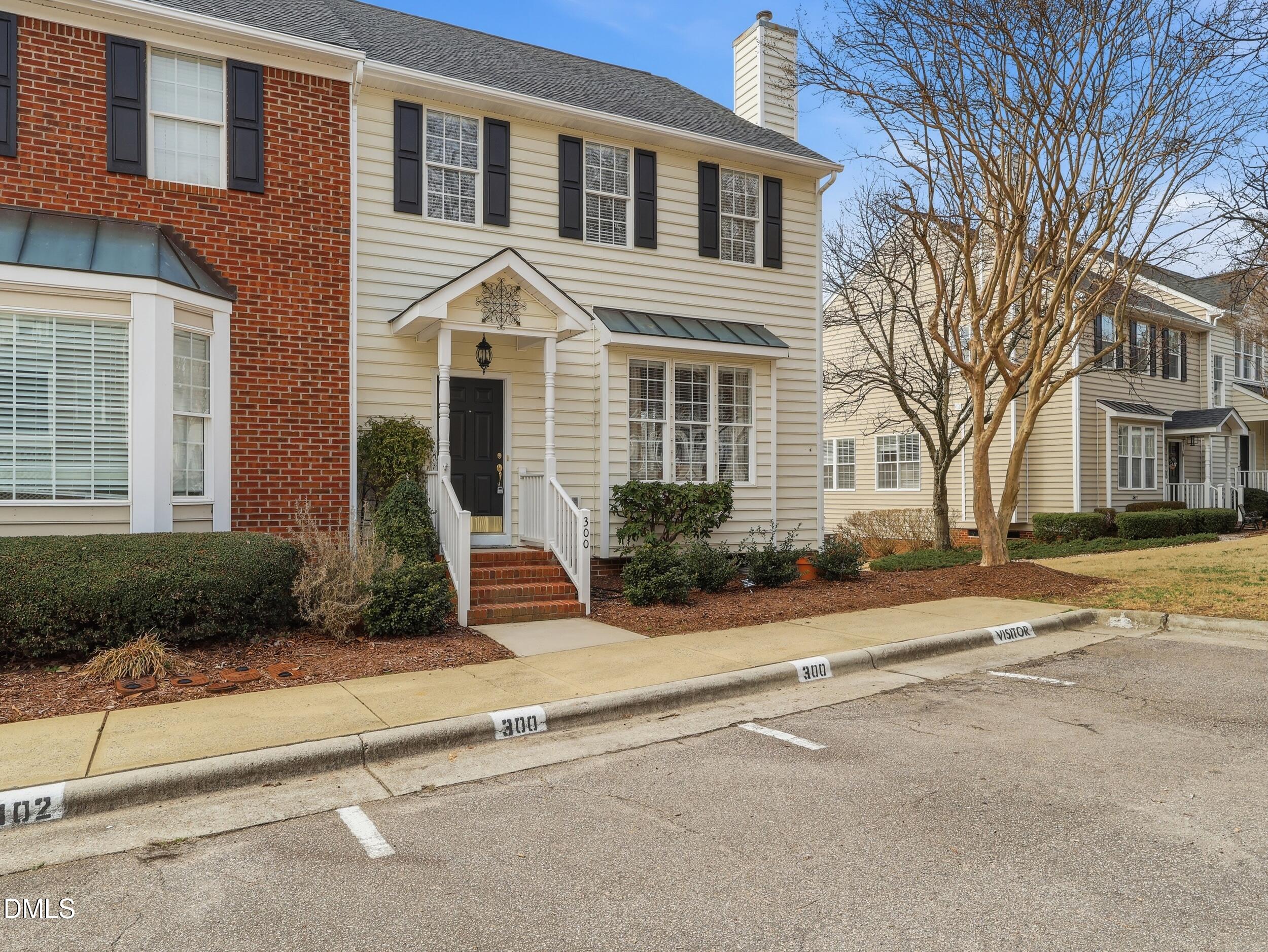 300 Nottinghill Walk Apex, NC 27502 - Photo 2 of 29 a front view of a house with garden