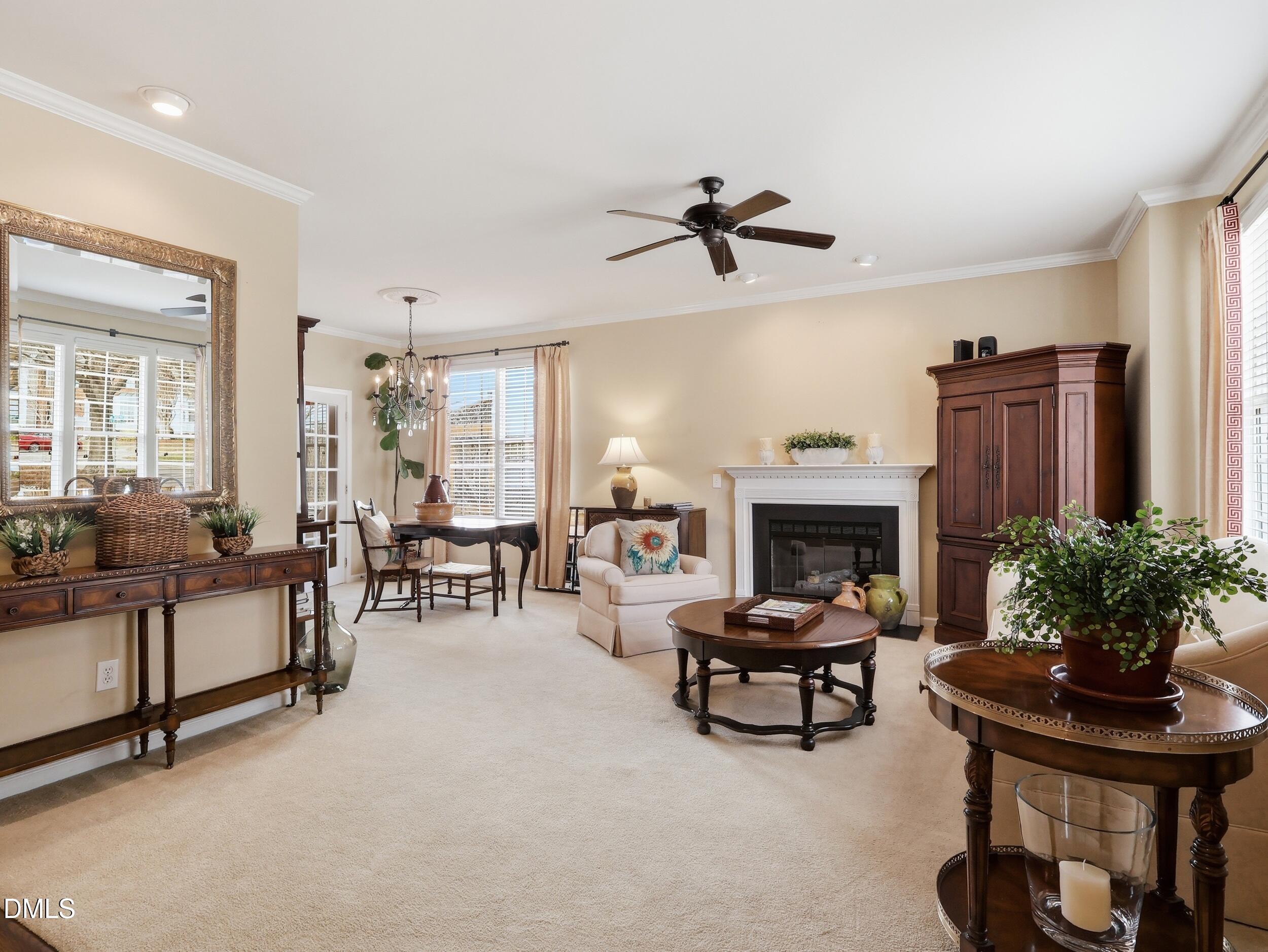 300 Nottinghill Walk Apex, NC 27502 - Photo 5 of 29 a living room with furniture and a fireplace