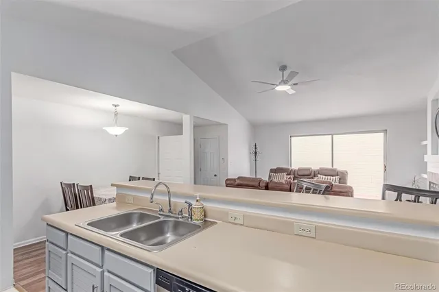 a kitchen with a sink cabinets and a window