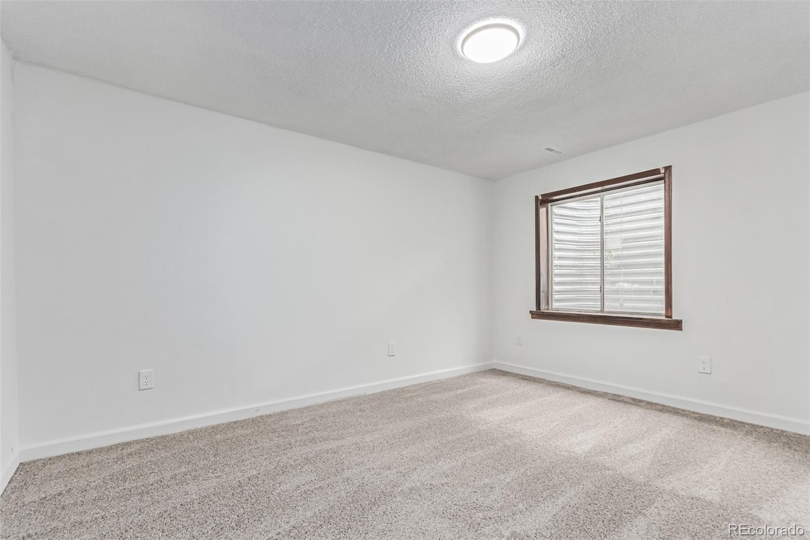 2675 South Deframe Circle Lakewood, CO 80228 - Photo 20 of 28 an empty room with a window