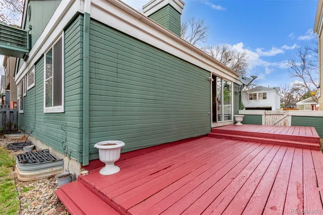 a view of a patio with wooden floor